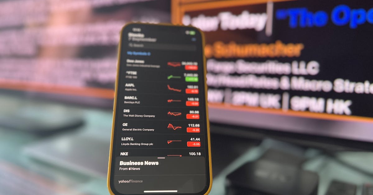 Smartphone displaying live stock market data on a London office desk