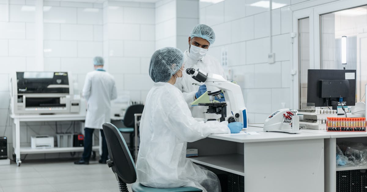 Biotech laboratory scientists working with research equipment