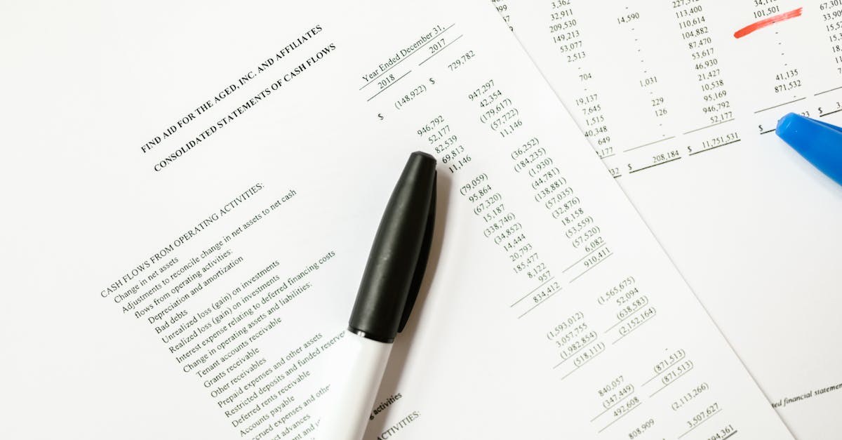 Financial documents and pen on a desk representing corporate bond issuance paperwork